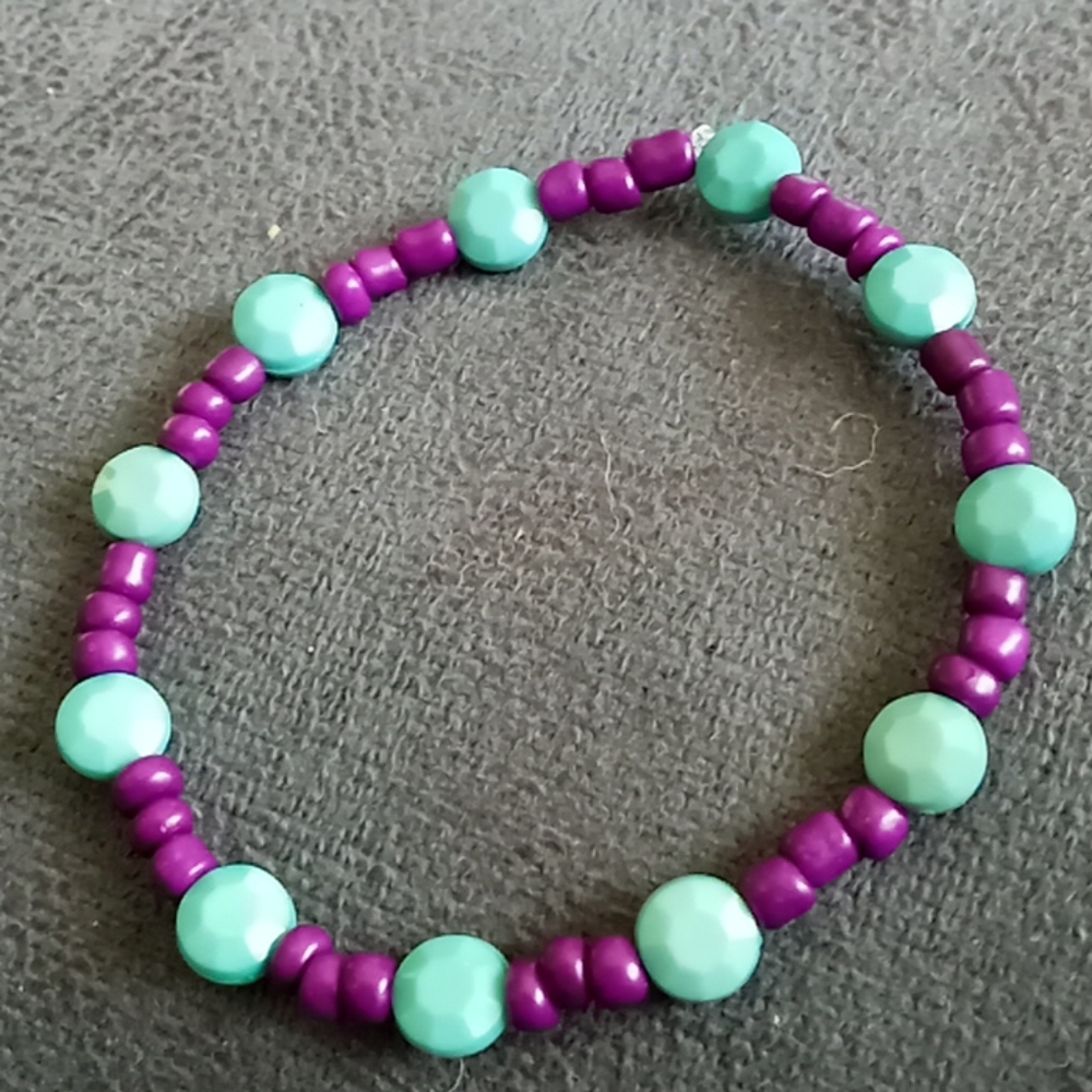 Hand Crafted New fire roasted aqua and purple crystal beaded bracelet